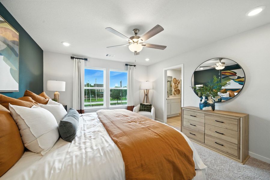 A bedroom with a large mirror. A bedroom with a large mirror.