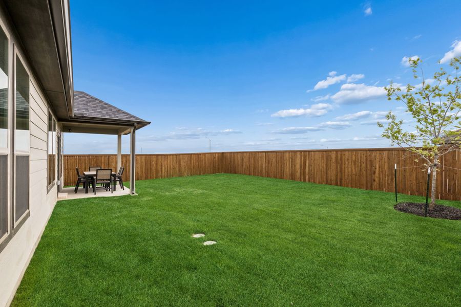 Covered Patio in a Madero New Winters Model in Haslet TX by Trophy Signature Homes