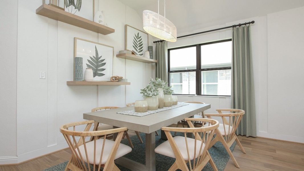 Sophisticated dining area features minimalist design, sleek wooden furniture, modern light fixture in Sunterra.
