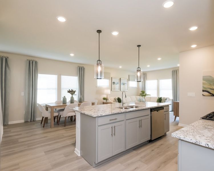 From the kitchen to living room, the open layout keeps everyone close. From the kitchen to living room, the open layout keeps everyone close.