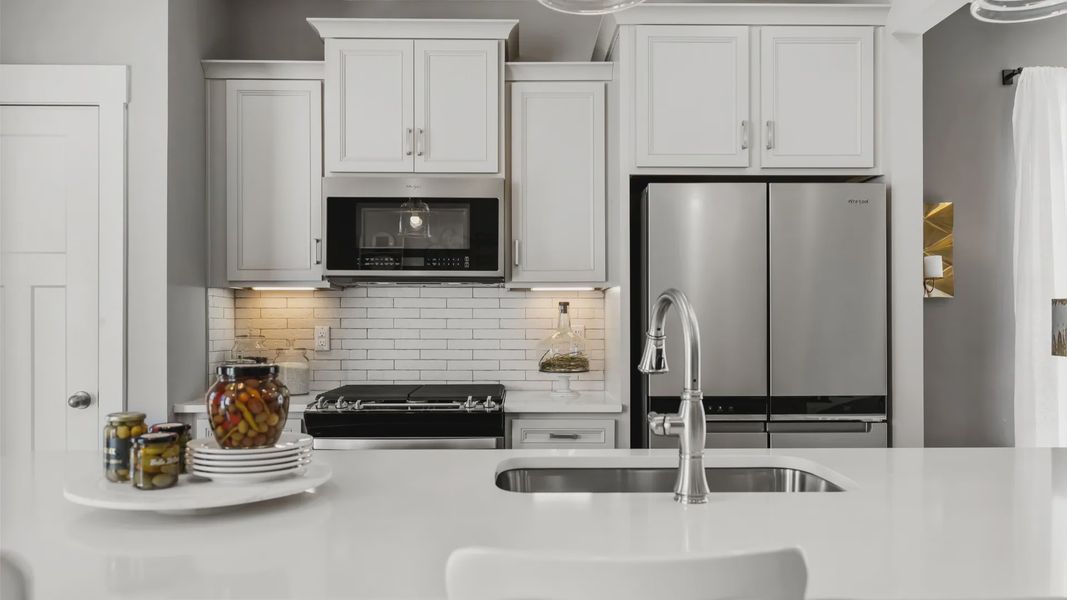 New two story townhome modern kitchen at Hickory Heights by DRB Homes near Downtown Greenville, SC