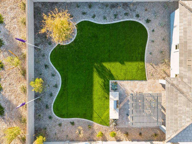 A building with a large green field. A building with a large green field.