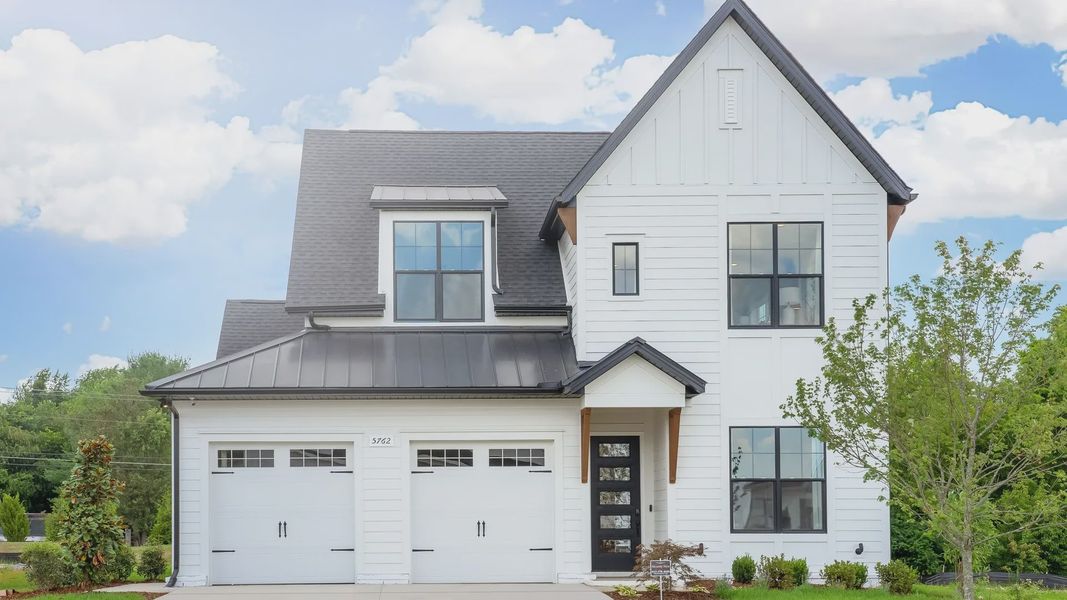 Exquisite modern facade with sleek black roof and expansive windows in Shelton Square, Tennessee.