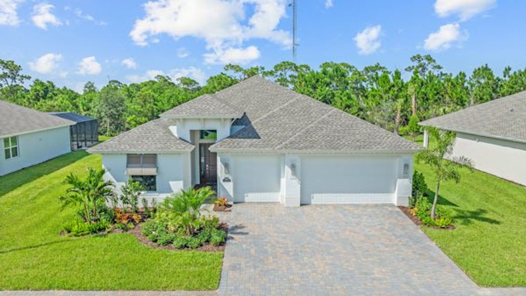 Front exterior of a home in the High Pointe community, located in Vero Beach, FL (Image 58).