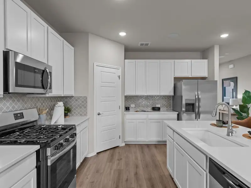 Furnished interior in a model home at Comanche Ridge in San Antonio (Image 5).