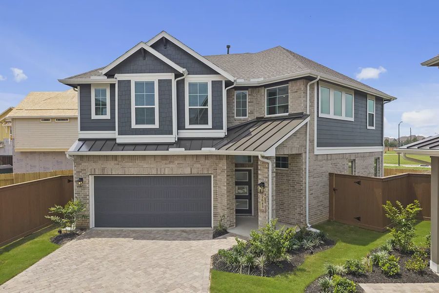 Front exterior of a home in the Elyson Courtyard Collection community, located in Katy, TX (Image 3).