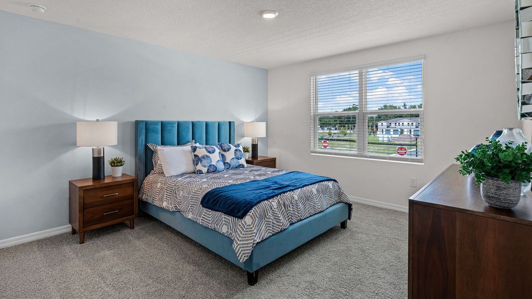 Furnished interior in a model home at Fish Lake Cove in Kissimmee (Image 25).