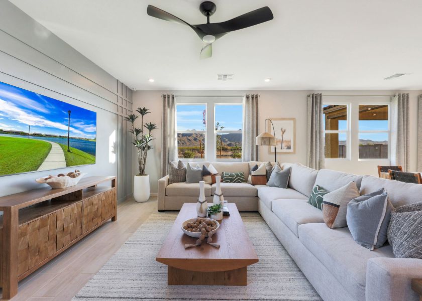 A living room with a large window. A living room with a large window.