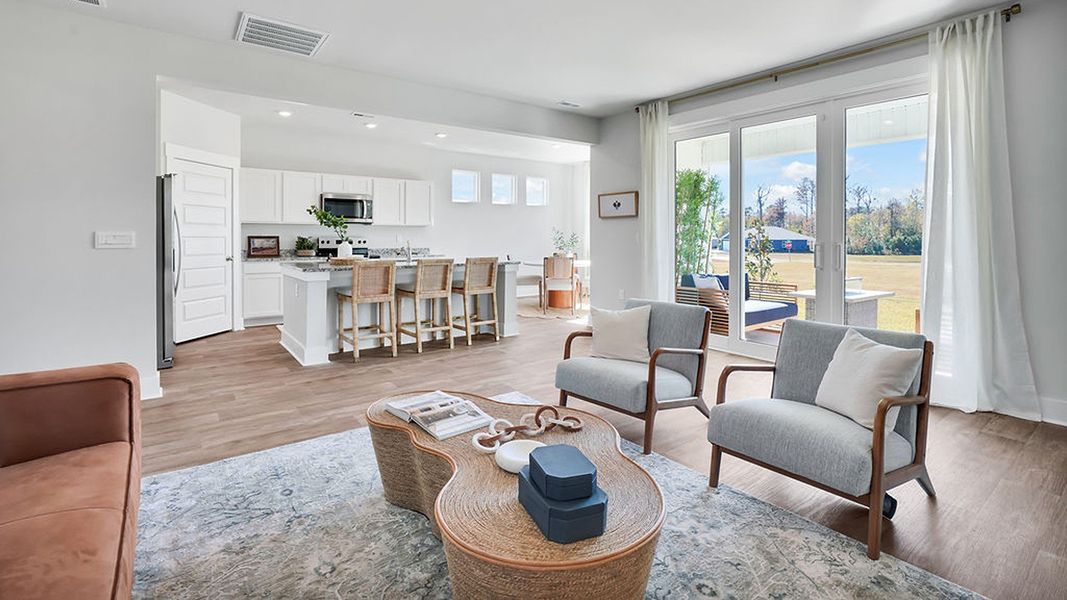 Furnished interior in a model home at Cedar Hill Landing in Navassa (Image 17).