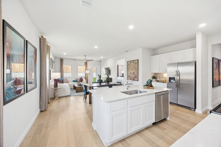 Kitchen in a Belmont Magnolia Model Home in Aubrey TX by Trophy Signature Homes Kitchen in a Belmont Magnolia Model Home in Aubrey TX by Trophy Signature Homes