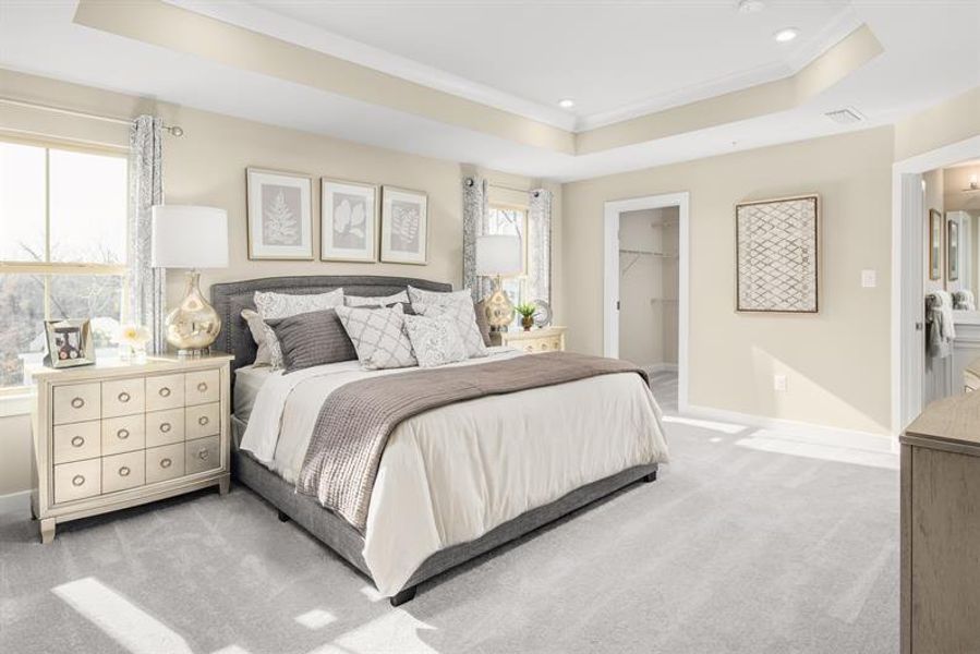 Spacious primary retreat with dual walk-in closets and a spa-inspired ensuite bath. Spacious primary retreat with dual walk-in closets and a spa-inspired ensuite bath.