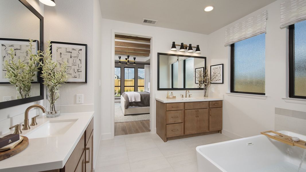 Furnished interior in a model home at Cross Creek West 55' in Fulshear (Image 18).