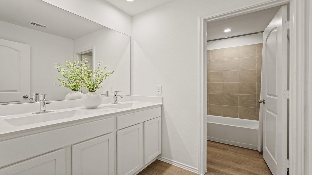 Furnished interior in a model home at Newport Pointe in Crosby (Image 26).