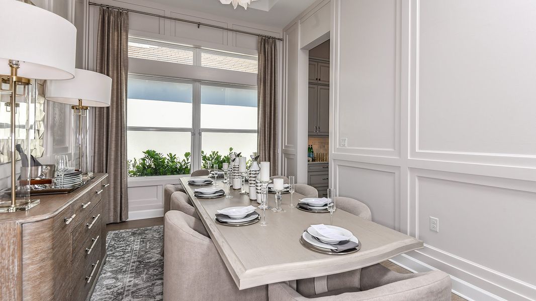 Furnished interior in a model home at Esplanade by the Islands in Naples (Image 59).