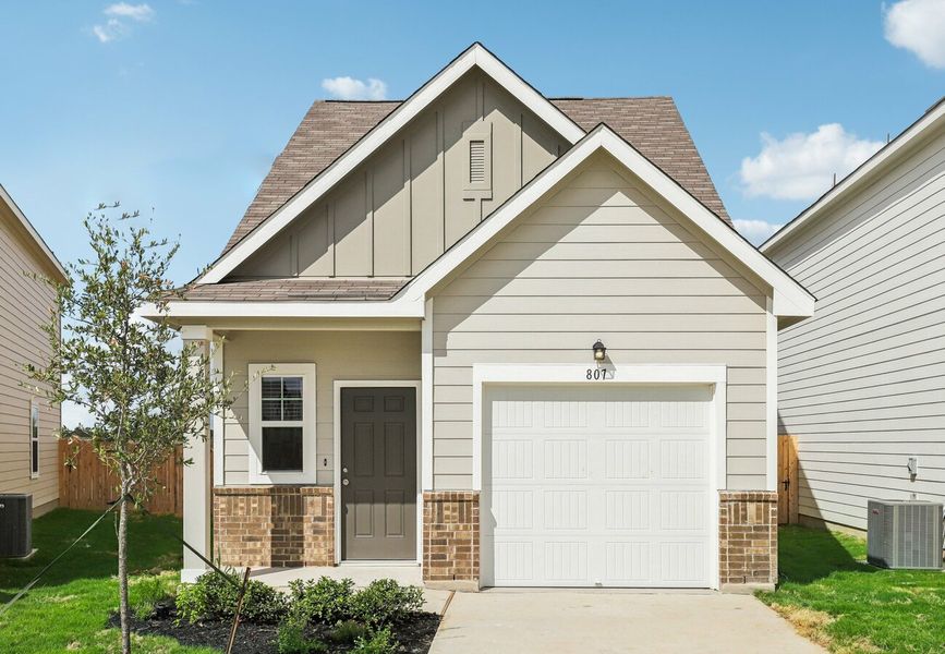 Front exterior of a home in the The Wilder community, located in Adkins, TX (Image 3).