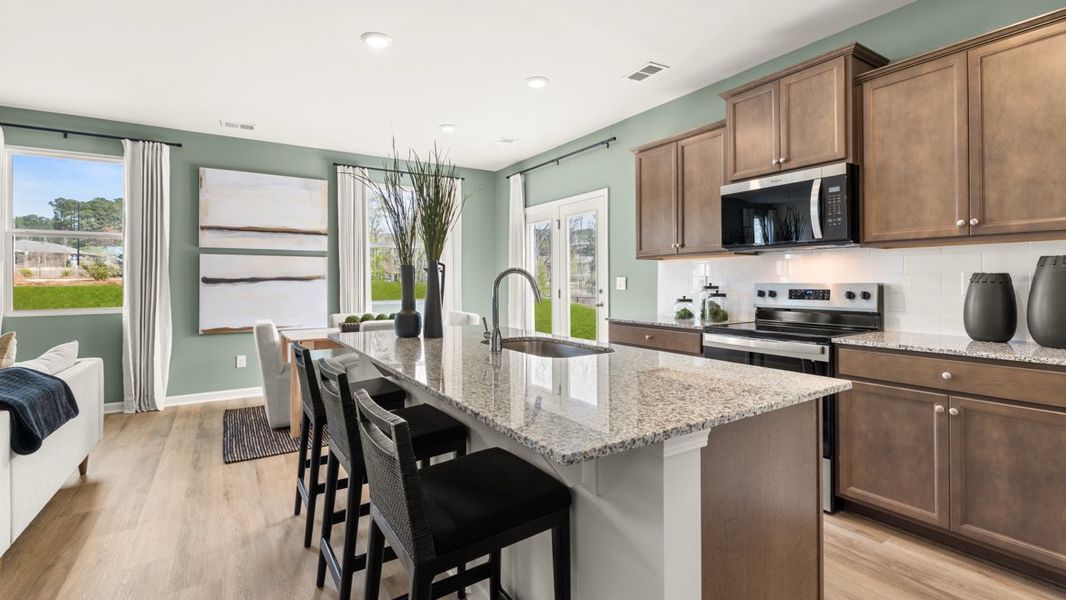 Furnished interior in a model home at Carlton in Douglasville (Image 8).