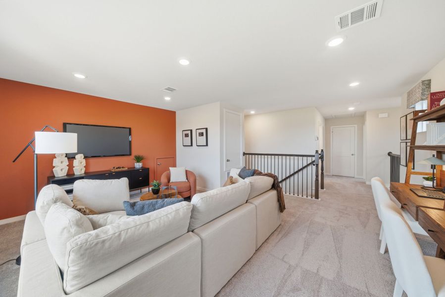 A living room with a couch and a tv. A living room with a couch and a tv.