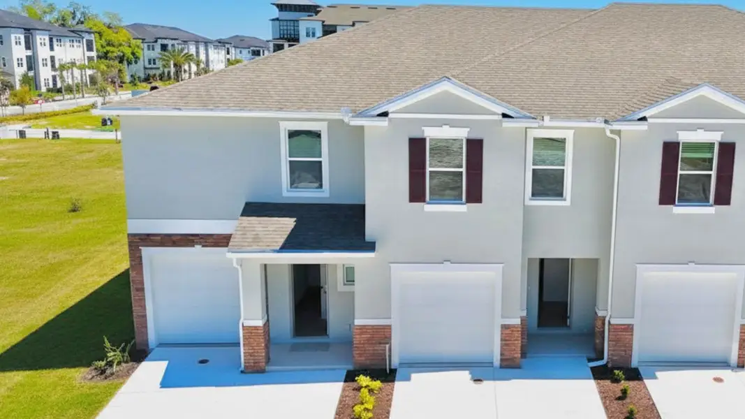Front exterior of a home in the Towns at Summit community, located in Deland, FL (Image 2). Front exterior of a home in the Towns at Summit community, located in Deland, FL (Image 2).