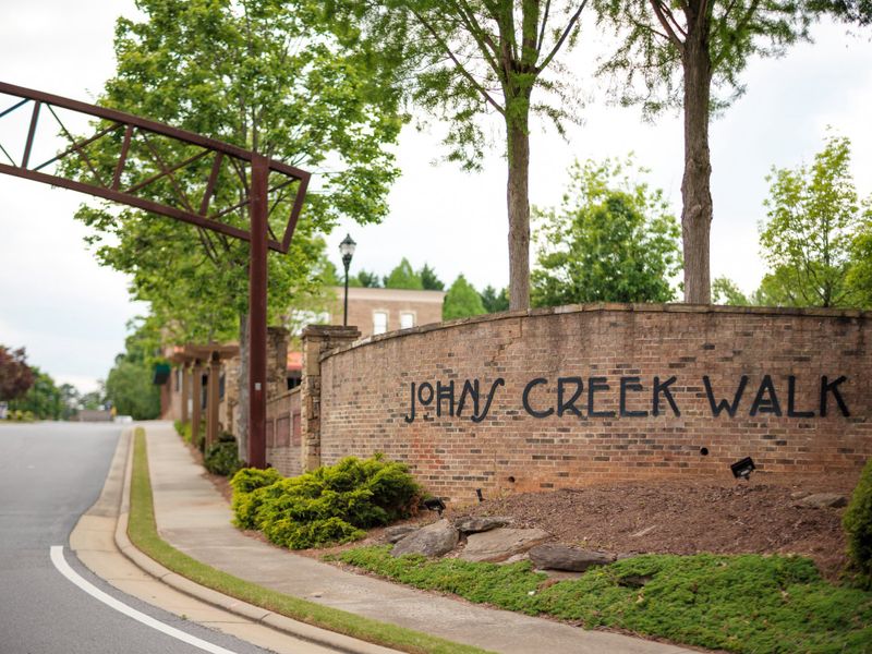 Entrance to the Ward's Crossing community in Johns Creek, GA, featuring signage and landscaping (Image 8). Entrance to the Ward's Crossing community in Johns Creek, GA, featuring signage and landscaping (Image 8).