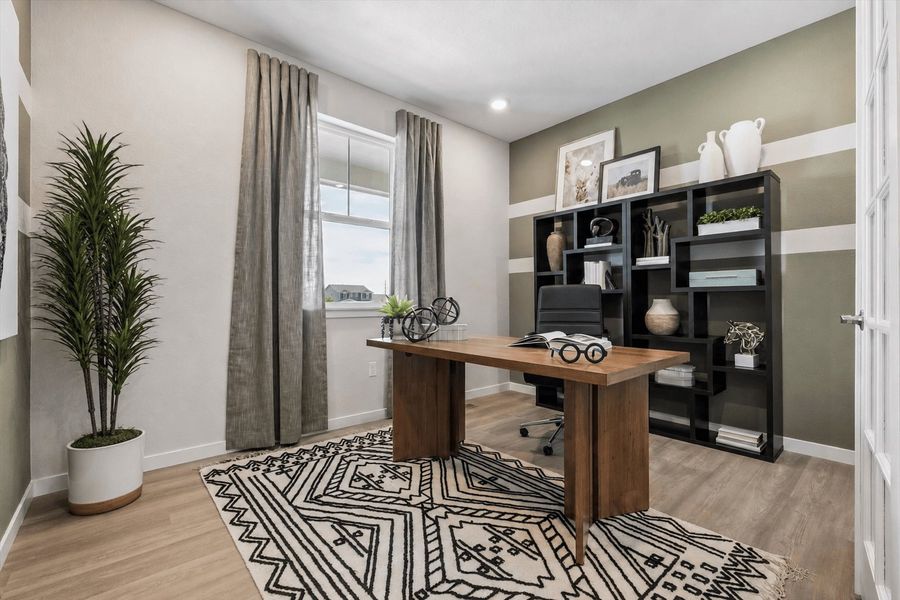 A room with a desk and a shelf with books on it. A room with a desk and a shelf with books on it.