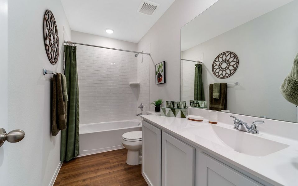 Furnished interior in a model home at The Pines at Seven Coves in Willis (Image 30).