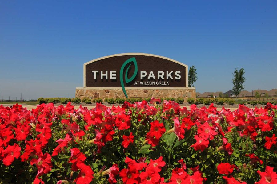 Entrance to the The Parks at Wilson Creek: 40ft. lots community in Celina, TX, featuring signage and landscaping (Image 2).