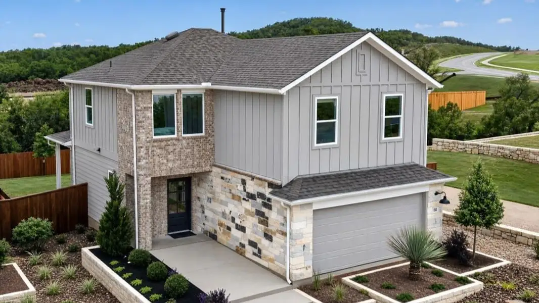 Front exterior of a home in the Village Grove community, located in Dripping Springs, TX (Image 2). Front exterior of a home in the Village Grove community, located in Dripping Springs, TX (Image 2).