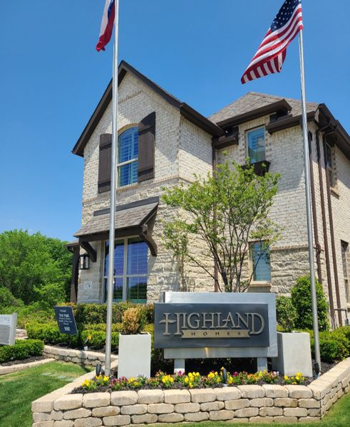 Charming stone home with rustic shutters and a landscaped yard in Aster Park: 40ft. lots by Highland Homes (McKinney, TX).