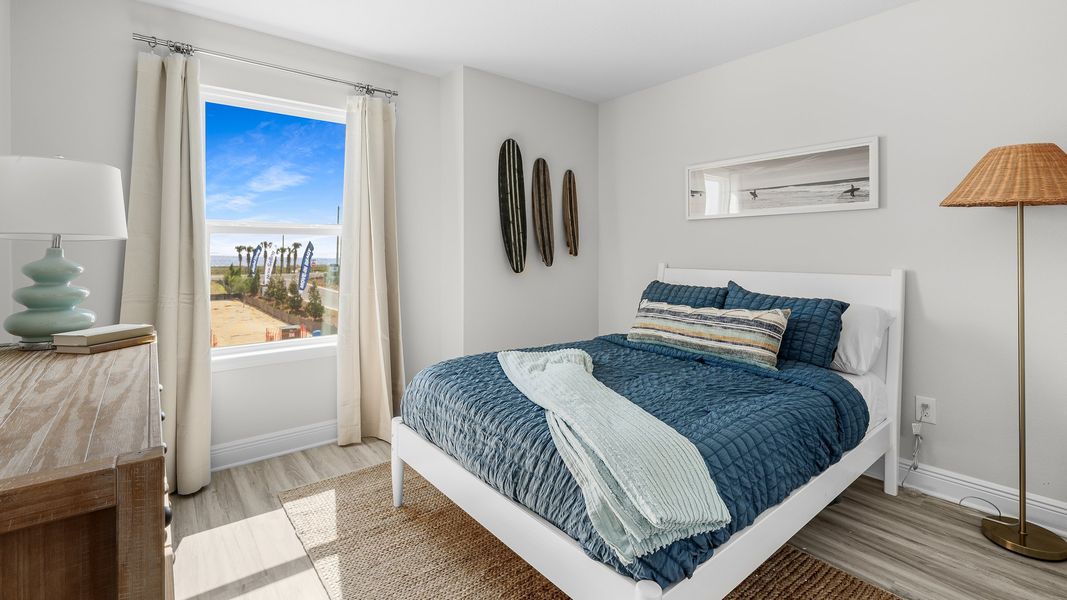 Furnished interior in a model home at WindMark Townhomes in Port Saint Joe (Image 27).