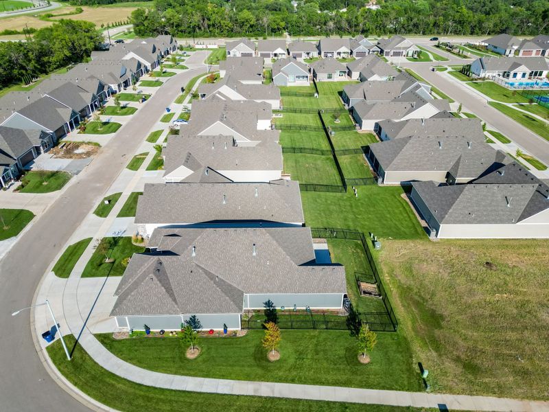 Aerial view of the The Courtyards at The Heritage community in Andover, KS, showing layout and nearby surroundings (Image 19). Aerial view of the The Courtyards at The Heritage community in Andover, KS, showing layout and nearby surroundings (Image 19).