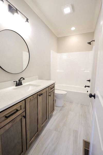 Furnished interior in a model home at Baker Road in Birchwood (Image 6).