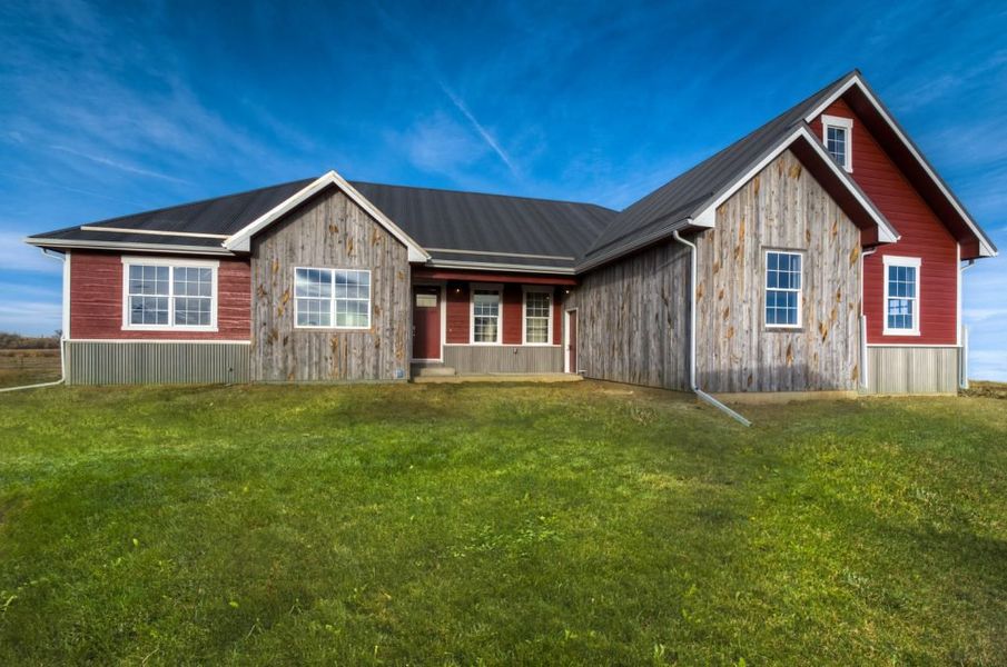 Front exterior of a home in the Red Barn community, located in Platteville, CO (Image 1).