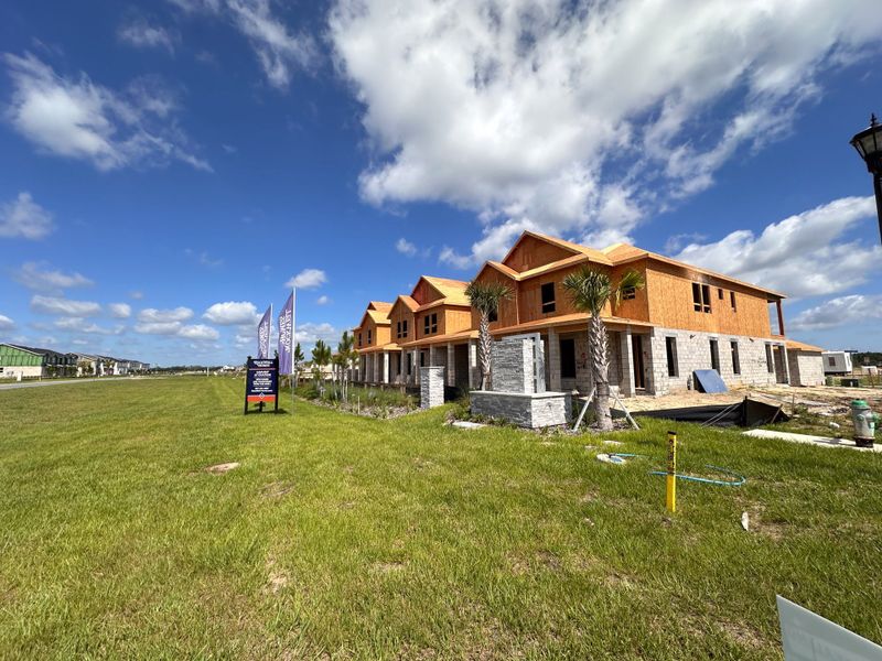 Newly constructed townhomes with stone accents in Harvest at Ovation by Rockwell Homes, Winter Garden, FL. Newly constructed townhomes with stone accents in Harvest at Ovation by Rockwell Homes, Winter Garden, FL.