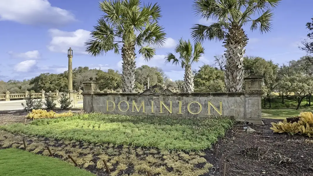 Entrance to the The Bluff At The Dominion community in Shavano Park, TX, featuring signage and landscaping (Image 1).
