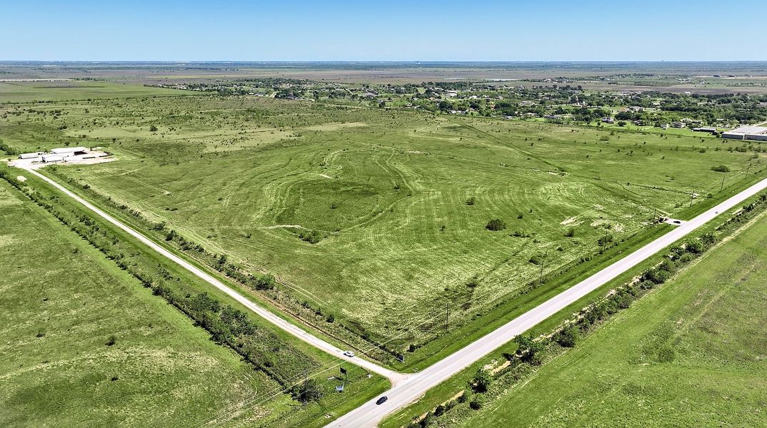 A road going through a field. A road going through a field.