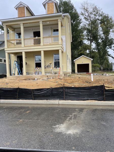 Charming yellow two-story home under construction in Oak Bluff by Dream Finders Homes (Charleston, SC). Charming yellow two-story home under construction in Oak Bluff by Dream Finders Homes (Charleston, SC).