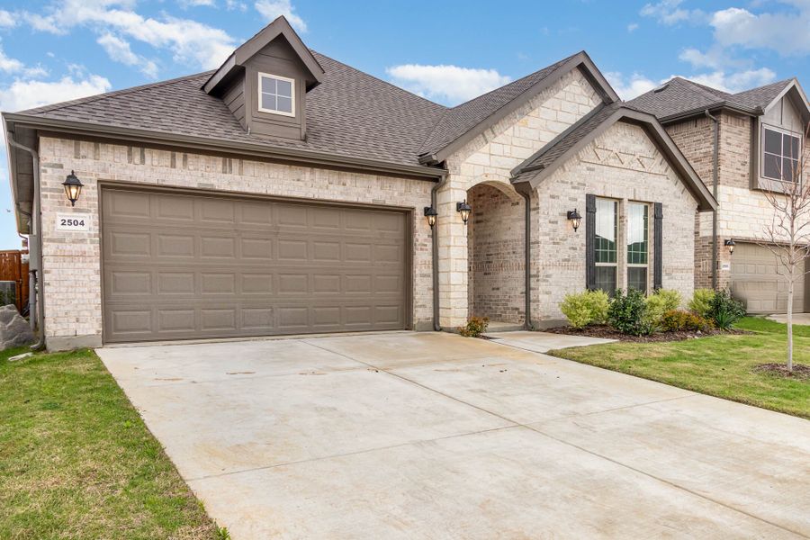Front exterior of a home in the Courts of Bonnie Brae community, located in Denton, TX (Image 7).