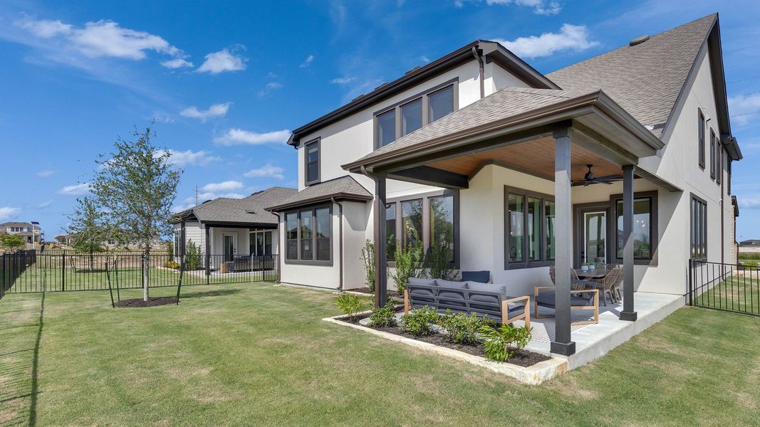 Elegant covered patio, expansive windows, and manicured lawn in exquisite Lakeside Meadows location. Elegant covered patio, expansive windows, and manicured lawn in exquisite Lakeside Meadows location.