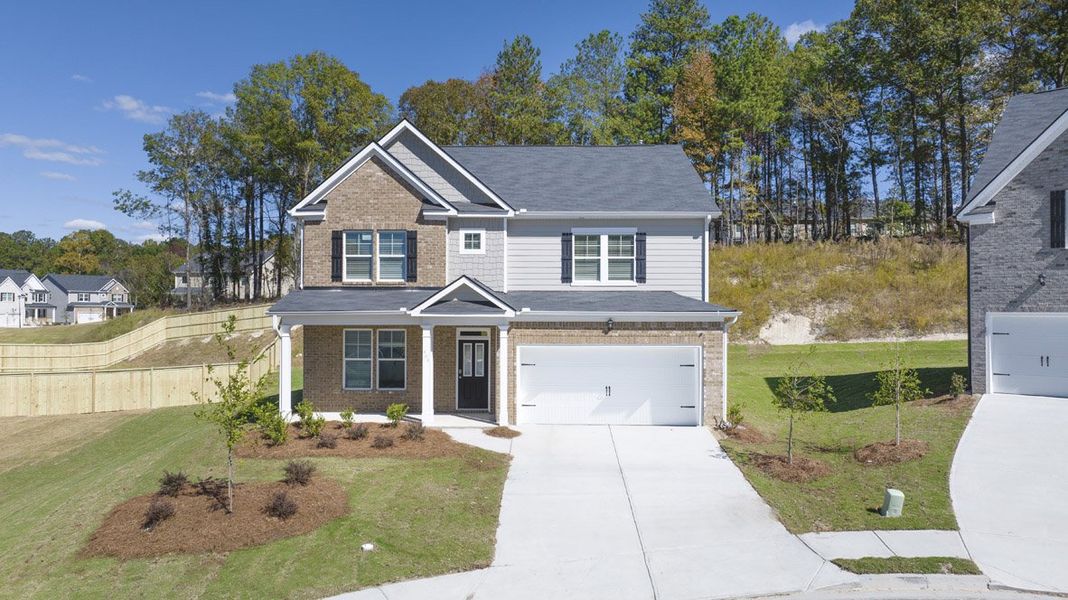 Front exterior of a home in the Water Oak Estates community, located in Lawrenceville, GA (Image 6).
