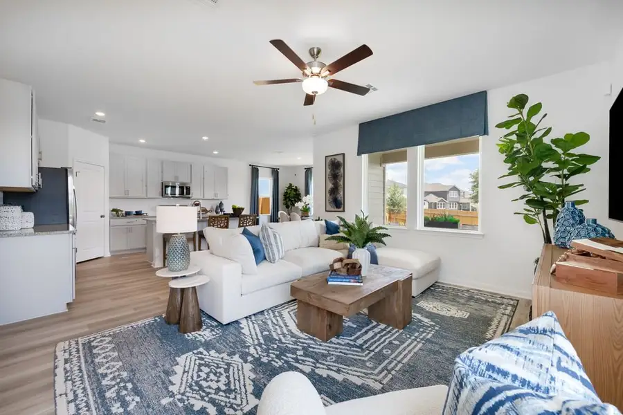 Furnished interior in a model home at Stonewall Ranch 40s in Liberty Hill (Image 6).