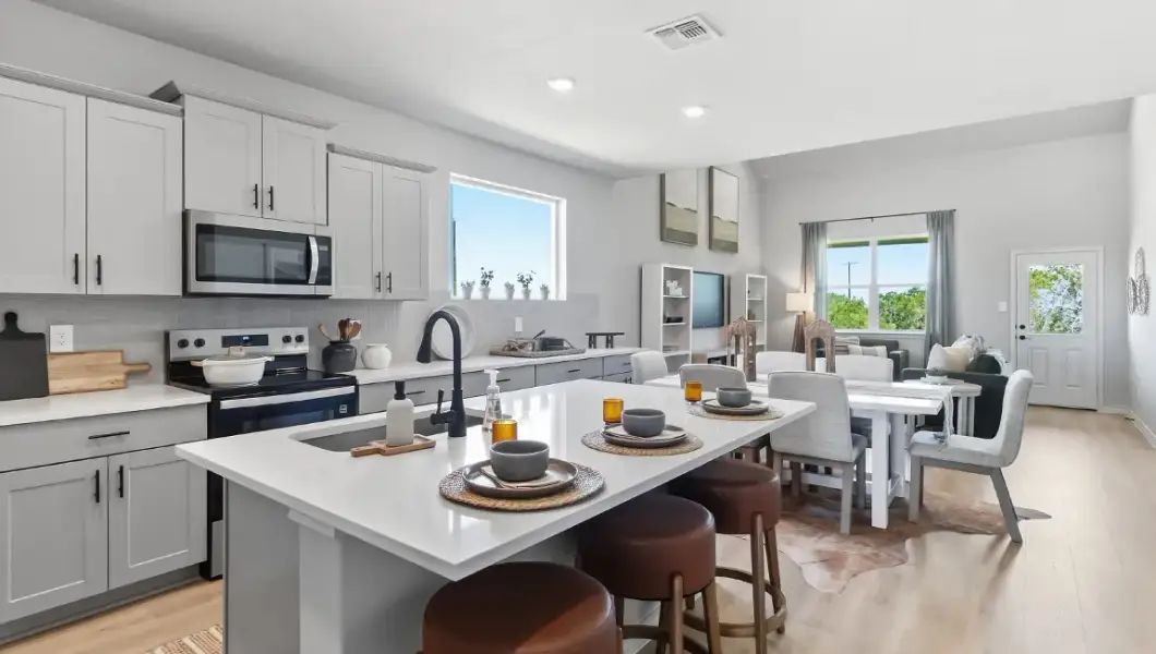Furnished interior in a model home at The Woodlands at Medina Hills in Mico (Image 31).