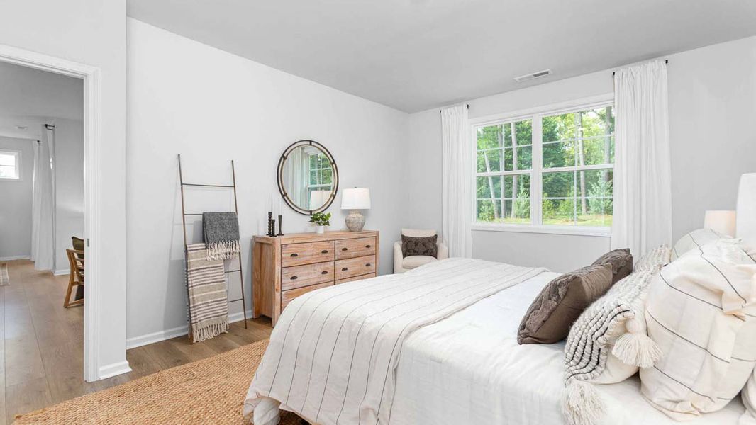 Furnished interior in a model home at Quarry Hills - Freedom in Swepsonville (Image 15).