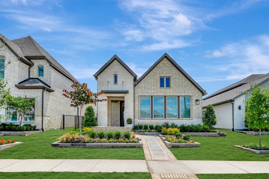 Front exterior of a home in the Prairieland Village - Grove Collection community, located in Cypress, TX (Image 5). Front exterior of a home in the Prairieland Village - Grove Collection community, located in Cypress, TX (Image 5).