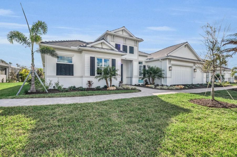 Front exterior of a home in the Artisan at Watercolor Place community, located in Bradenton, FL (Image 59).