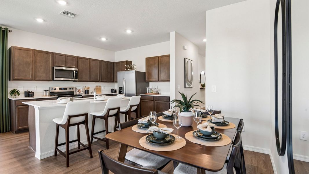 Furnished interior in a model home at Sanctuary at Citrus Park Townhomes in Tampa (Image 9).