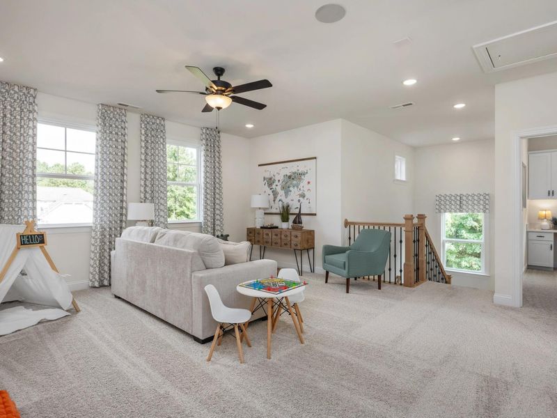 Furnished interior in a model home at Addison West in Holly Springs (Image 25).