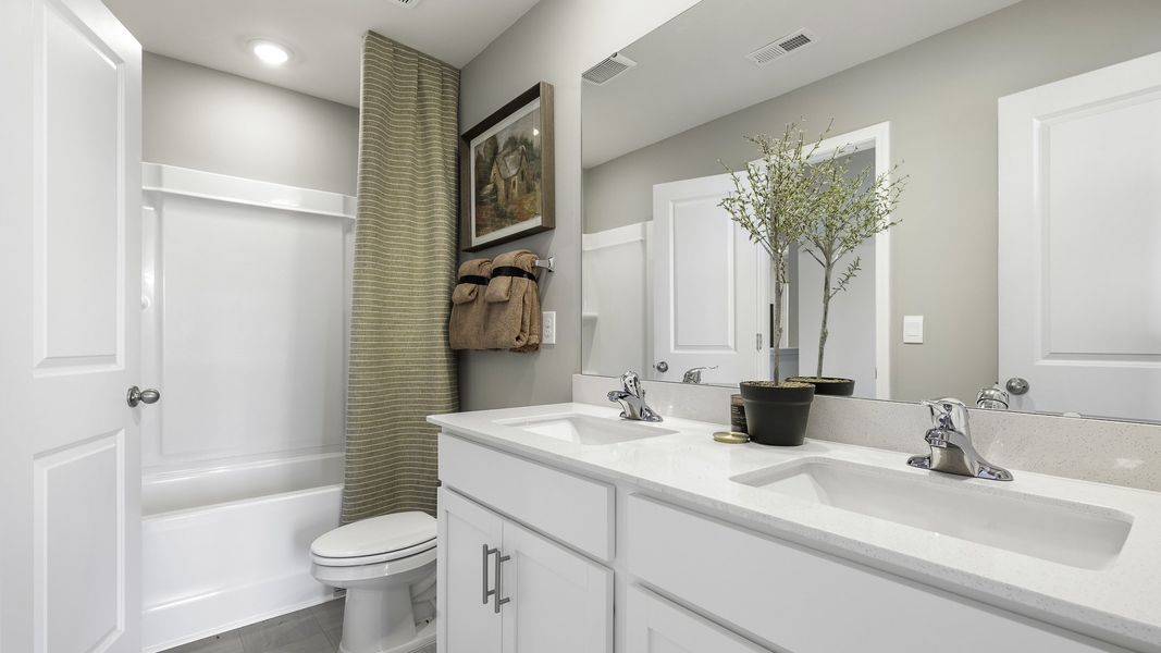 Furnished interior in a model home at Aurora Acres in Snow Camp (Image 28).