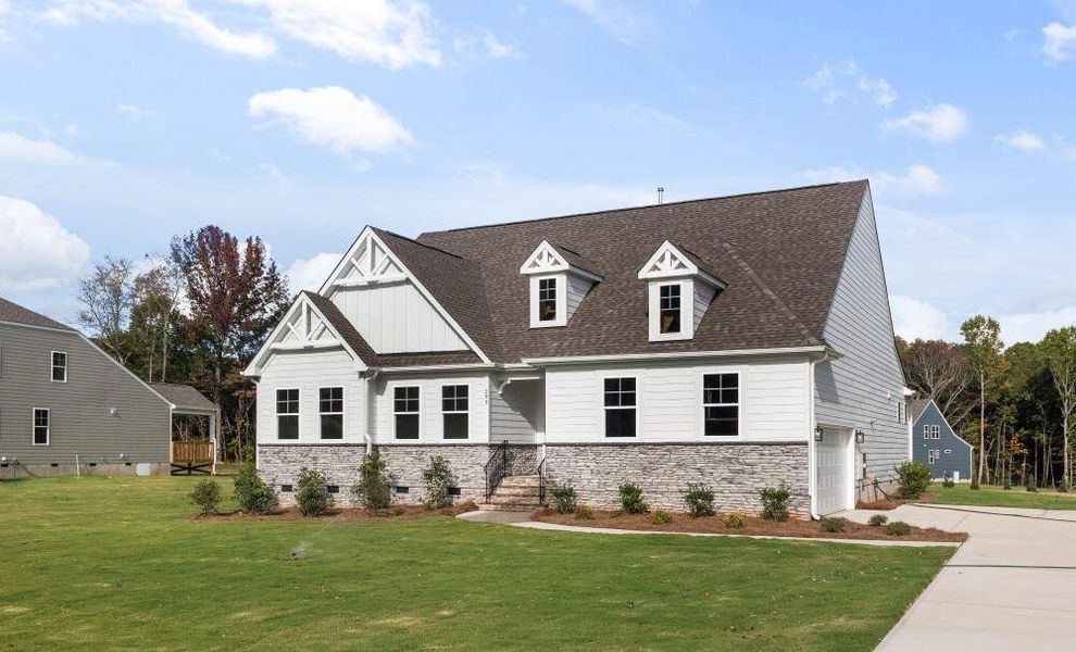 Front exterior of a home in the The Enclave at Hidden Lake - 55+ Community community, located in Youngsville, NC (Image 3).