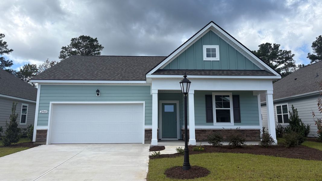Front exterior of a home in the Brunswick Plantation community, located in Ash, NC (Image 21). Front exterior of a home in the Brunswick Plantation community, located in Ash, NC (Image 21).