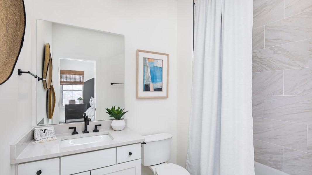 Secondary bedrooms each feature an en-suite bathroom